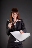 depositphotos 5571997 Cheerful businesswoman with documents and pen